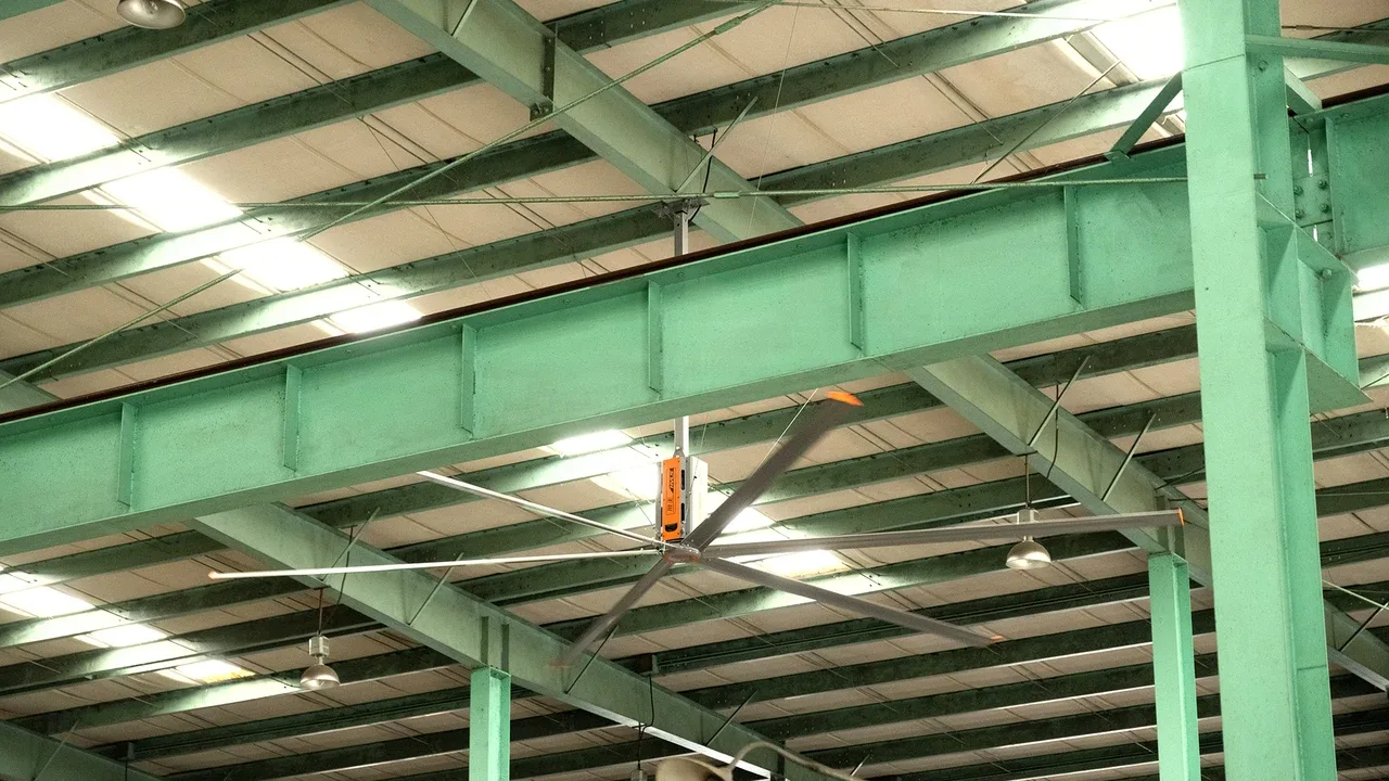RTFANS industrial HVLS fan operating in heavy manufacturing plant