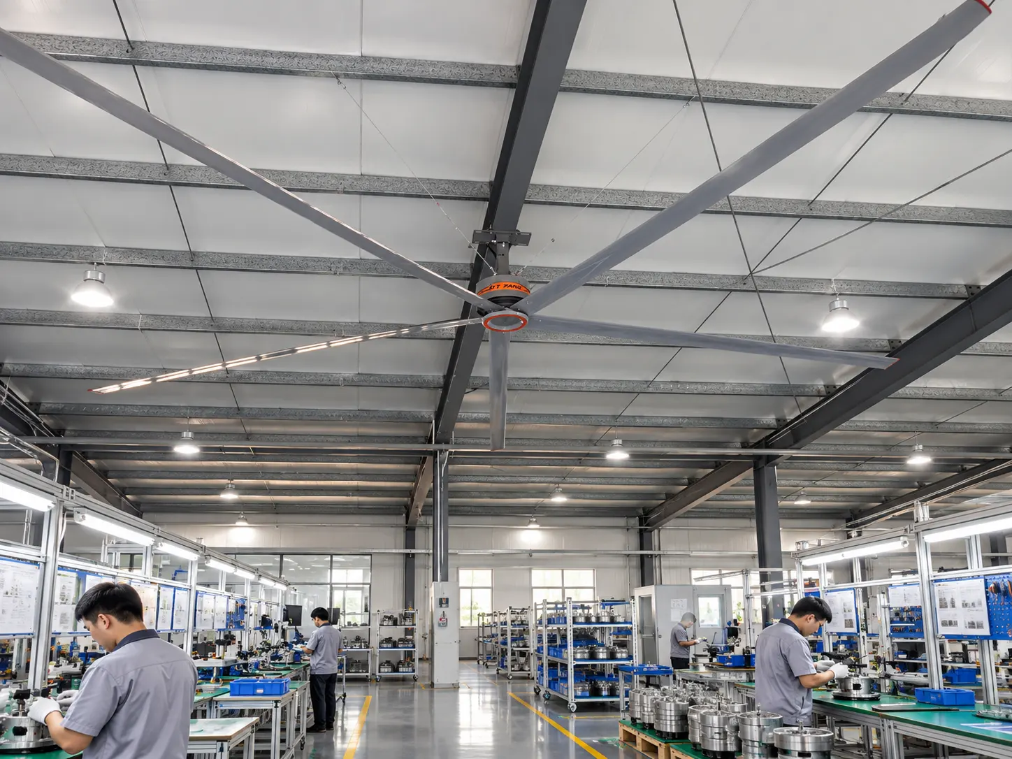 RTFANS Fengcai five-blade HVLS ceiling fan above an OEM and ODM engineering workshop